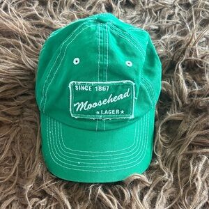 Moosehead Lager Green Baseball Cap with white stitching.